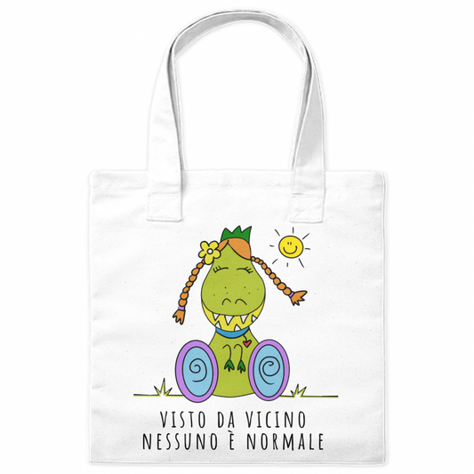 Borsa shopper con l'illustrazione di Dina, il dinosauro con disabilità, che porta un messaggio positivo di inclusione e accettazione.